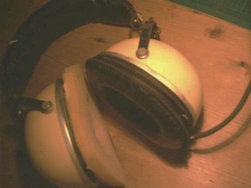 vintage headphones with pink foam on the left earpiece